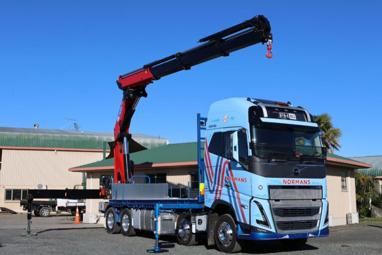 Normans Transport Volvo FH16 8x4 crane truck with HMF 5020 K6 crane raised, built by MIMICO